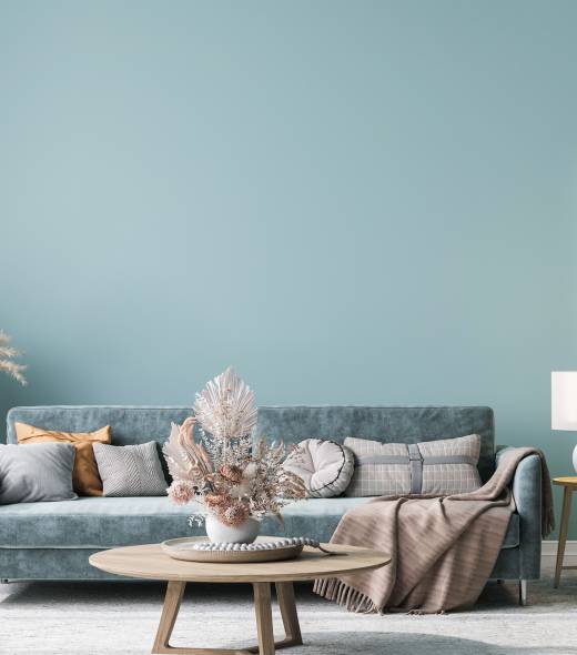 Home interior mock-up with blue sofa, wooden table and decor in blue living room, 3d render